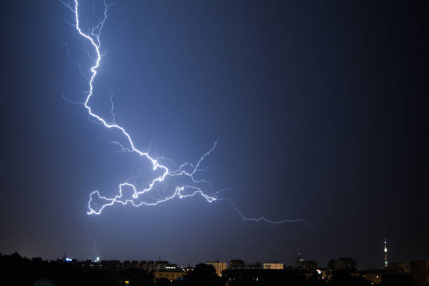 istock Bright lightning in the black sky over the city 1190734426