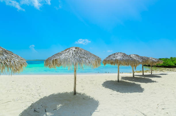 amazing view of las Brujas island Cuban beach and tranquil, turquoise inviting ocean against blue sky background stock photo