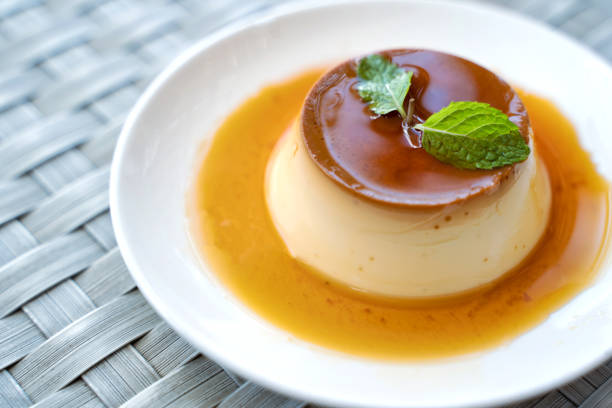Pudding Caramel Custard with top view of a creme caramel, caramel custard or custard pudding in white plate.