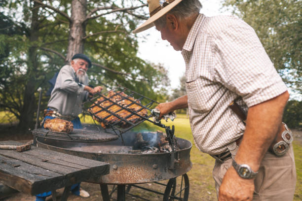 istock Argentine tradition, gauchos preparing a costillar or rib 1190739247