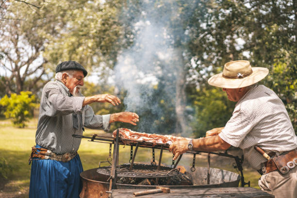 istock Natives preparing a rib barbecue in the firewood 1190739300