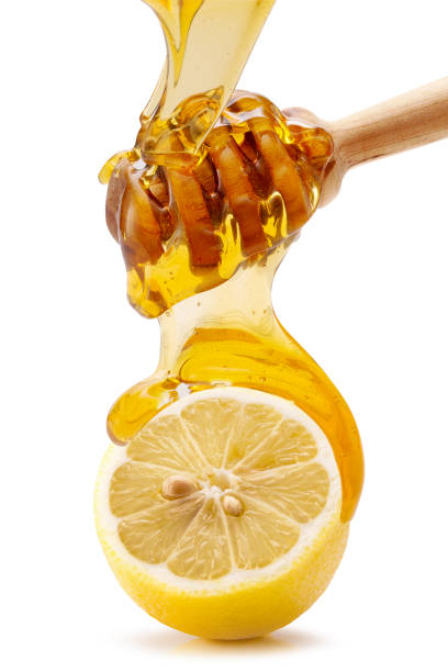 istock dropping honey into lemon isolated on a white background 1190741902
