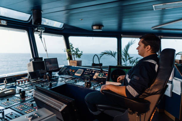 istock Marine navigational officer during navigational watch on Bridge . Work at sea 1190743836