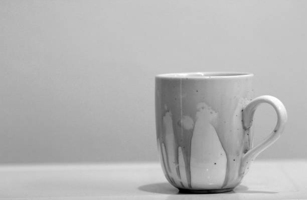 istock Coffee stain on  white coffee cup with black and white picture 1190746783