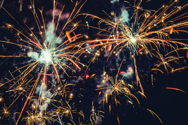 istock Fireworks at New Year and copy space abstract holiday background. Brightly Colorful Fireworks on twilight background with free space for text. New Year 1190747656