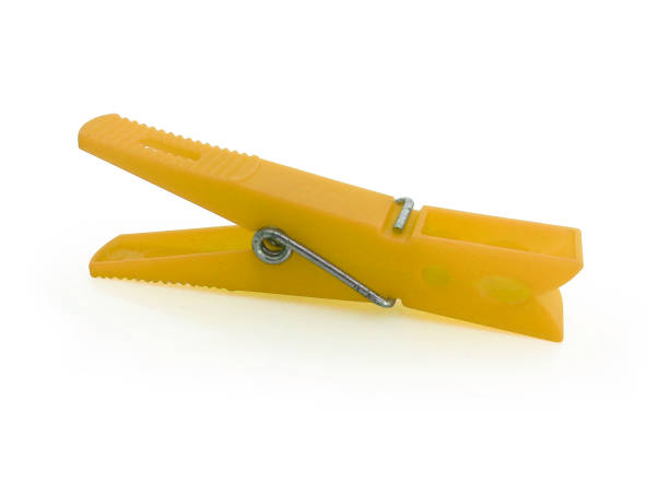 istock Yellow plastic clothespin isolated on white background 1190750033