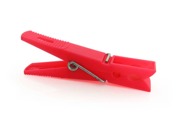 istock Red plastic clothespin isolated on white background 1190750037