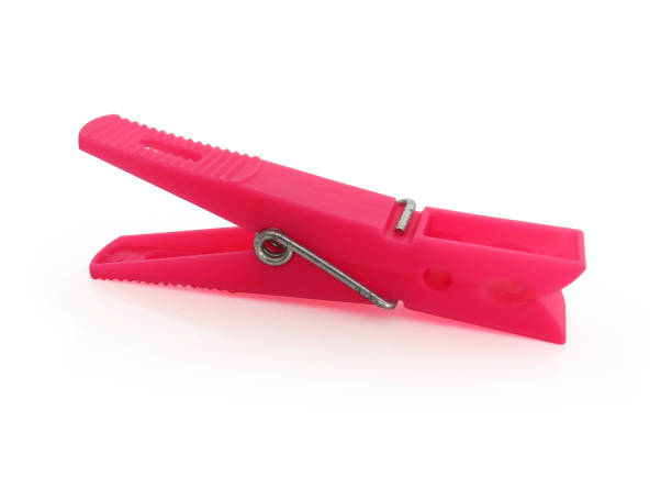 istock Pink plastic clothespin isolated on white 1190753287