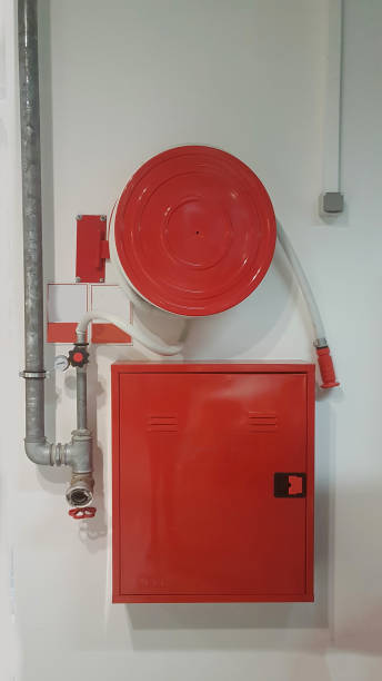 istock fire hose extinguisher for building safety 1190754444