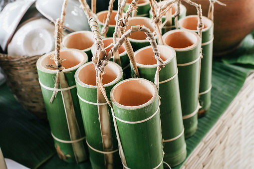 Bamboo tube can be used as a glass to drink water.Use for background.Ecological bamboo tube for drinking water, Concept to reduce global warming