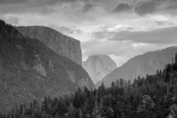 istock Half Dome peaking its head out over the top of the mountains. 1190757682