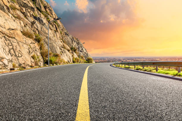 istock Empty road and mountain with city skyline in Shanghai. 1190758008