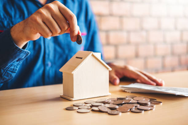 istock Man calculator Accounting Calculating with money stack step growing saving money for Home 1190763092