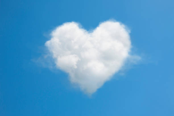 istock Heart Shaped Cloud in the Blue Sky 1190768709
