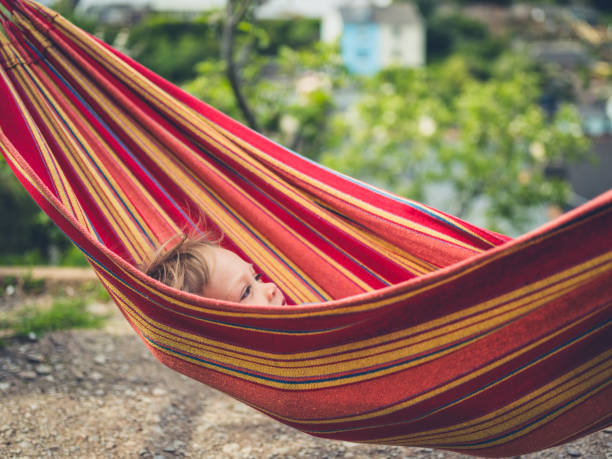 istock Little toddler relaxing in a hammock 1190769264