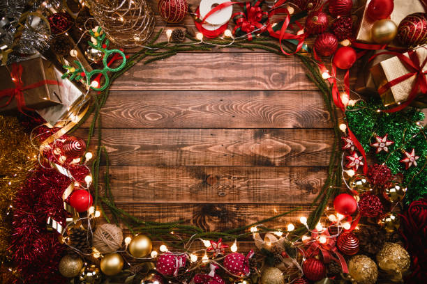 istock Christmas greeting card.Christmas flat lay composition, holiday decorations, Christmas tree gifts on the wooden background with copy space for your text. 1190770684