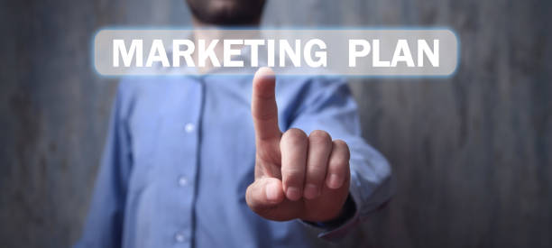 istock Man touching in Marketing Plan text in screen. 1190771427