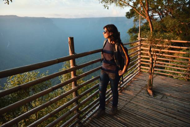 istock A solo traveller woman looking at a valley view 1190776200
