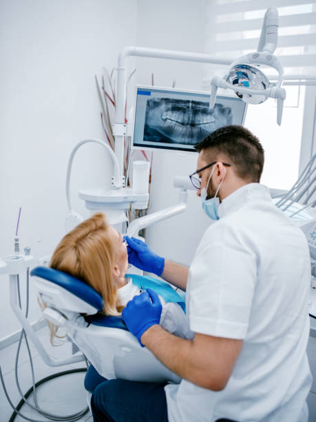 istock Woman having teeth examining at dentist 1190777291