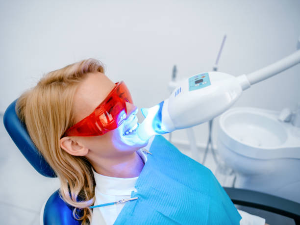 istock Ultraviolet light procedure at dentist office 1190778559