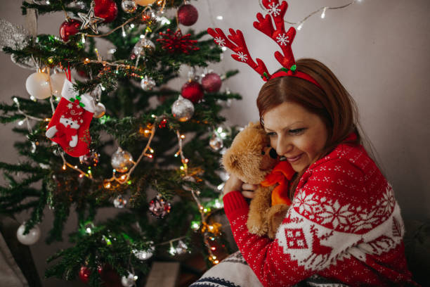 istock Daydreaming by the Christmas tree 1190779276