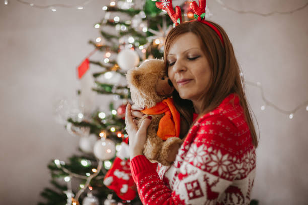 istock Daydreaming by the Christmas tree 1190779567