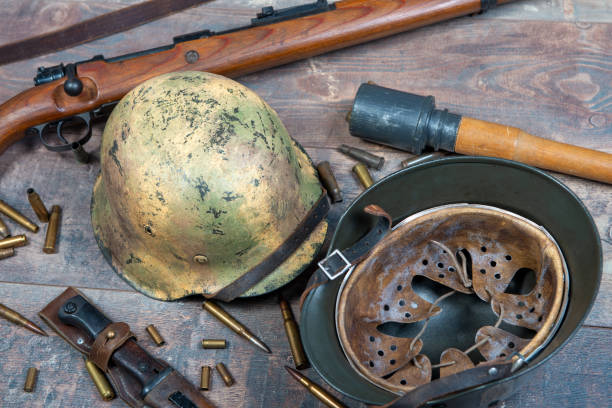 istock ww2 german army field equipment with helmets and a rifle 1190785264