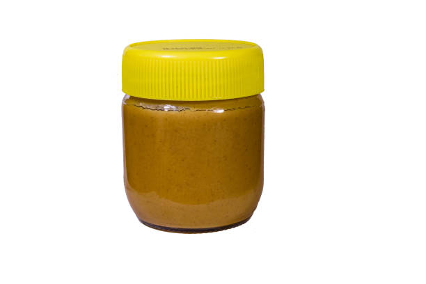 istock Glass jar with peanut butter isolated on a white background 1190787050