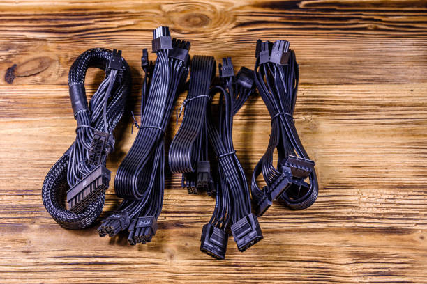 istock Set of computer psu cables on a wooden background 1190787195