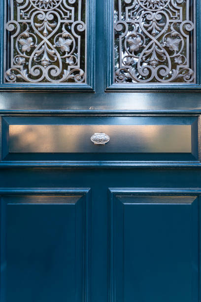 istock Wooden door with ornate window grate 1190792263