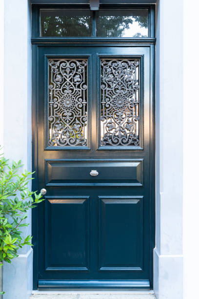 istock Wooden door with ornate window grate 1190792291