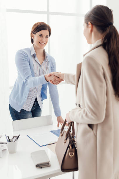 istock Businesswoman giving an handshake 1190792861