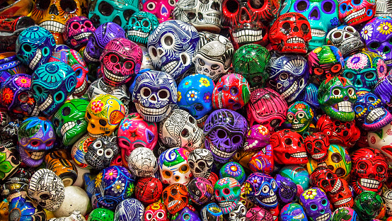 Merida, Mexico, April 20 - Dozens of Calaveras (colored skulls) for sale in the center of Mexico City, local handicrafts often used during the Dia de Muertos celebrations and much appreciated by tourists and visitors.