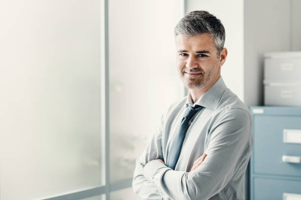 istock Businessman posing in the office 1190795696