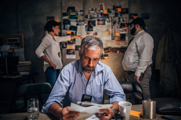 istock Detective working on criminal case with colleagues in office 1190798680