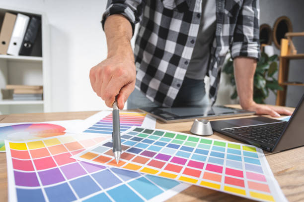 istock Young adult designer working with graphic tablet in office 1190799256