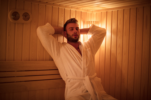 Every man deserves a moment to relax. Young man in sauna.