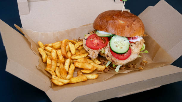 istock Meaty hamburger and fries on a table 1190802058