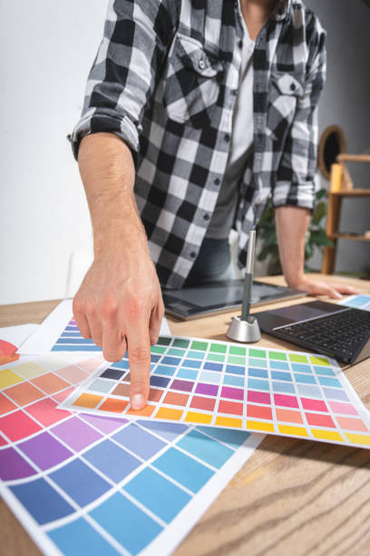 istock Young adult retoucher working with graphic tablet in office 1190803287