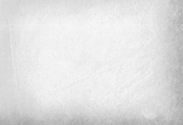 A sheet of white paper with a crumpled surface