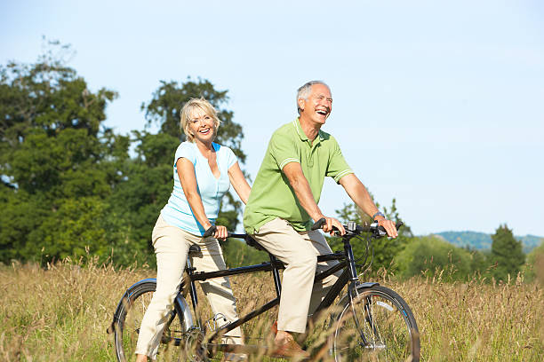 istock Mature couple riding tandem 119080377