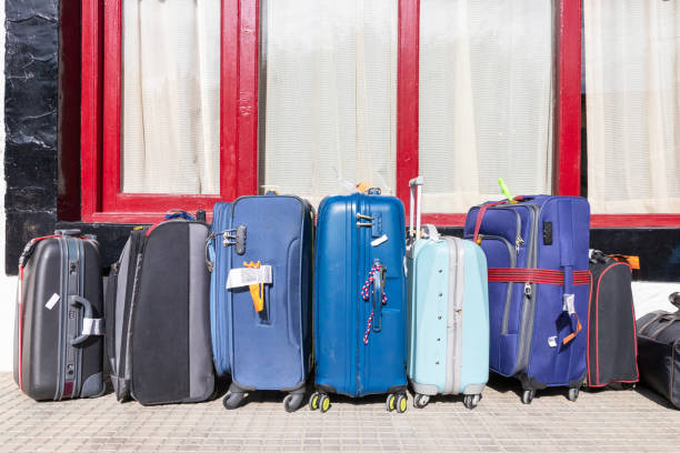 istock Suitcases multicolor waiting for hotel check-in. Travel Concept. 1190804484