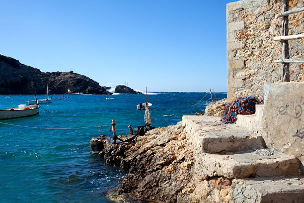 Rocky outcrop in the morning sun, by the sea in San Antonio, Ibiza