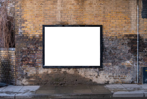 Blank billboard on brick wall for customisation and mockup in an urban location