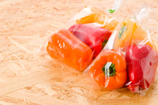 istock fresh Colored bell pepper in plastic bag on OSB plywood board background 1190810765