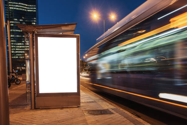 istock Blank bus stop with billboard at night 1190811159