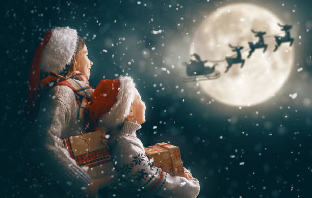 istock children with xmas presents 1190815643