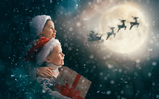 istock children with xmas presents 1190815677