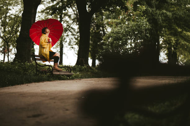 istock Sad woman on rain 1190817615