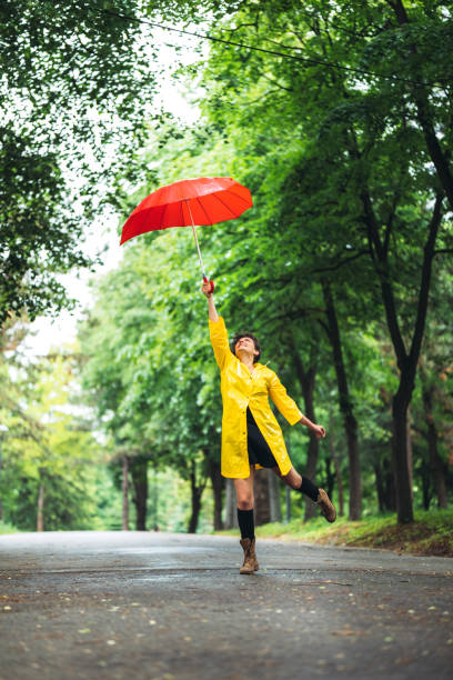Woman in park at rain